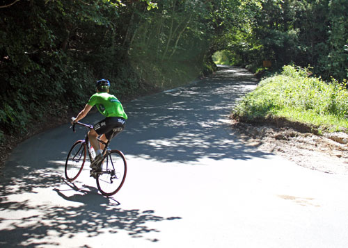 This is a hairpin on Box Hill. The rider is taking a wide route. 