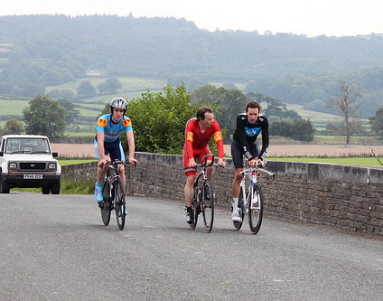 Wiggins, Hutchinson and an unknown club cyclist riding together.