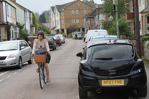 cyclist-parked-cars-either-side